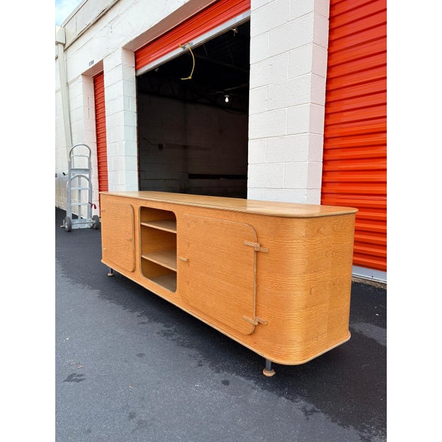 A beautifully designed mid-century modern media console crafted circa 1960s–1970s in the Mid-Century Modern style,...