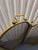 This antique brass fireplace screen features a classic four‑panel folding design with arched tops, fine mesh panels, and...