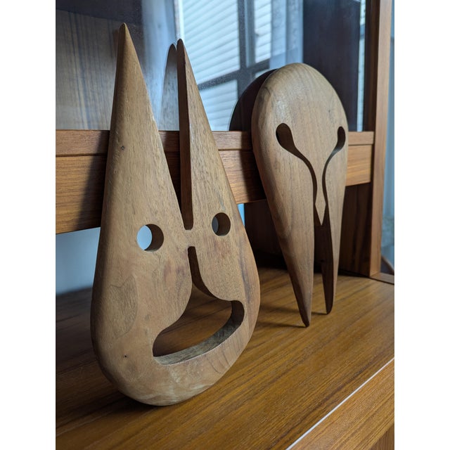 An extraordinary, highly sculptural pair of original vintage 1970s Mid-Century Modern abstract wall masks. Hand-carved...