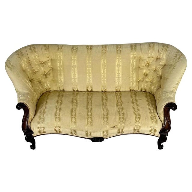 A handsome 19th-century English settee, finely crafted from mahogany and distinguished by its elegant proportions,...