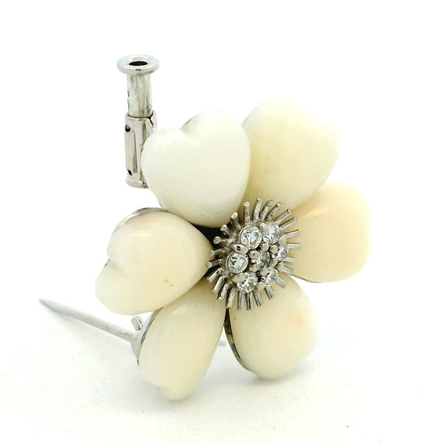 Elegant vintage Italian flower brooch crafted in 18K white gold, featuring six softly sculpted mother-of-pearl petals...