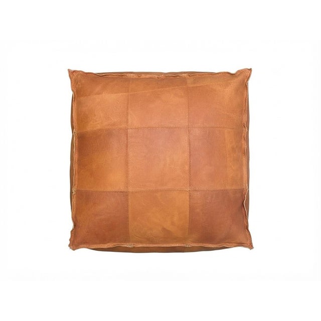 DESIGN & PIPED EDGE CONSTRUCTION Handcrafted in Marrakech from premium bovine leather, treated and hand-dyed in warm tan...