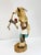 Beautifully hand-carved White Buffalo Kachina doll, featuring fur accents, a feathered bow, painted leather skirt, tiny...