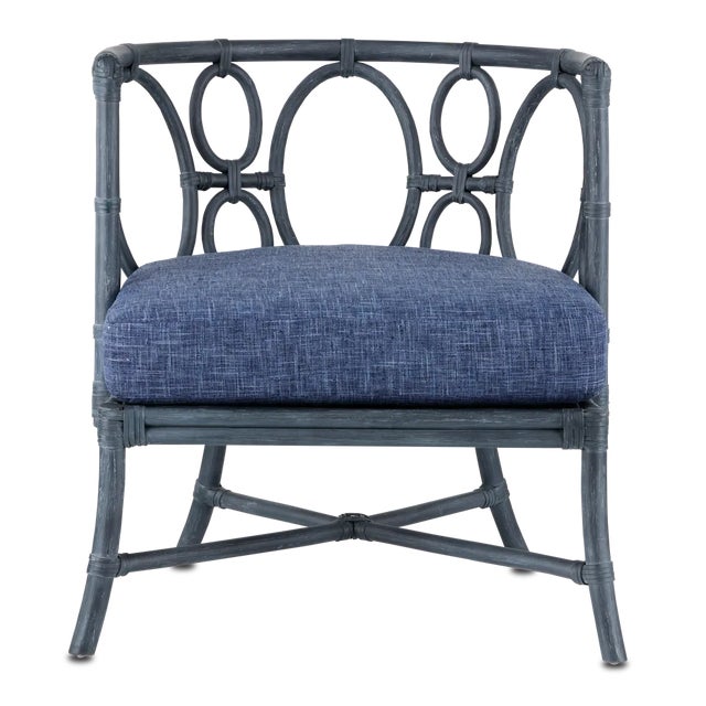 The Tegal Finn Navy Chair is made of solid rattan using a very traditional rattan construction technique, though instead...