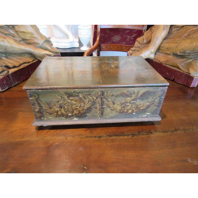 A rare Dutch painted bible box with wonderful paintings of birds and garlands. The ball feet are original, as are the iron...