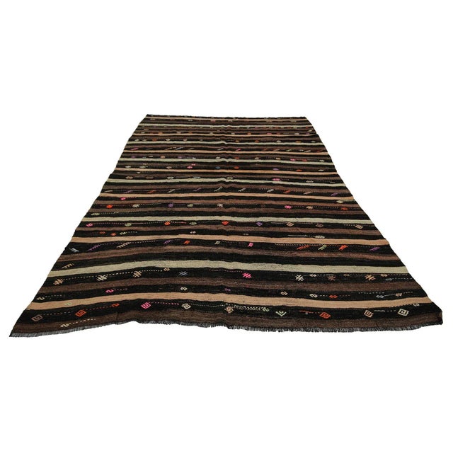 Handwoven vintage kilim rug from Afyon region of Turkey. Approximately 50-60 years old. In very good condition.