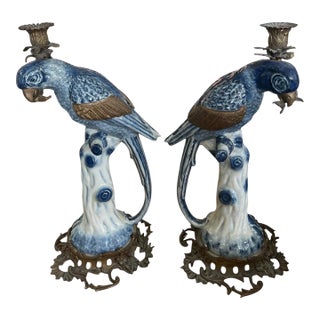A Pair of Vintage Hollywood Regency Style Blue & White Ceramic Parrot Candle Holders For Sale