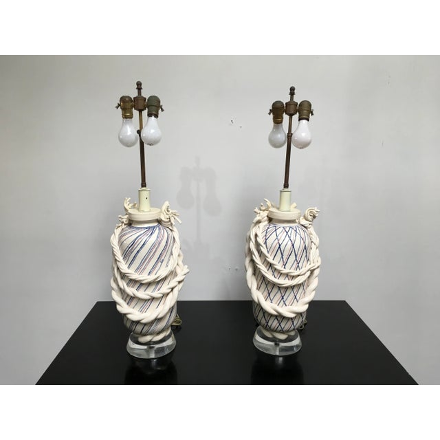 An extraordinary and highly uncommon pair of postmodern ceramic table lamps by California ceramic artist Roy Hamilton,...