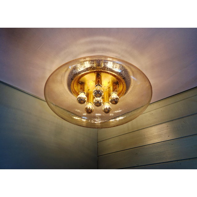 Large ceiling light in brass and bubble-blown glass (45 cm diameter), produced by the german manufacturer glashütte...
