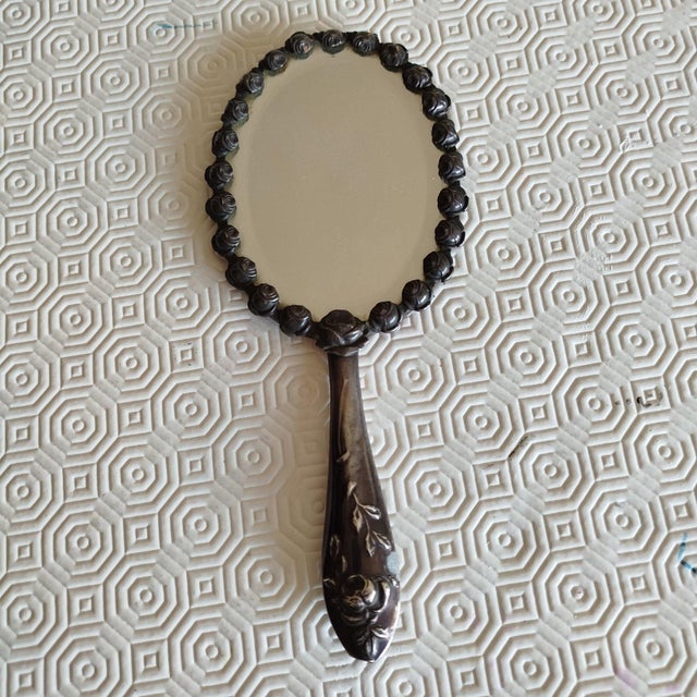 Silver Hand Mirror. 127 grams. Height: 8.67 in (22 cm) Width: 3.94 in (10 cm) Depth: 0.4 in (1 cm) This piece has an...