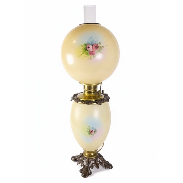 Antique No. 329 “Gone with the Wind” hurricane banquet lamp featuring an ornate cherub figural base with beautifully hand-...
