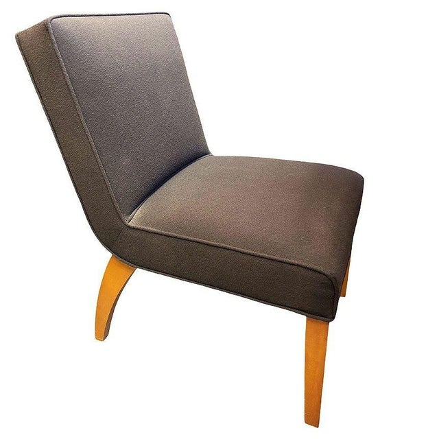 A refined pair of mid-century modern slipper lounge chairs, designed with clean, architectural lines and a low, relaxed...