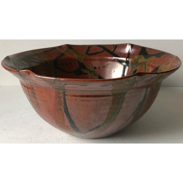 This fabulous large handmade studio art pottery bowl features abstract patterns in Black on a rich Brown ground.12" x 12"...