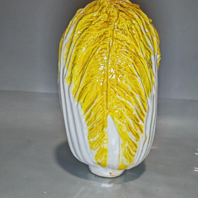 Add a touch of whimsical charm and auspicious symbolism to your home with this striking ceramic Napa cabbage sculpture....