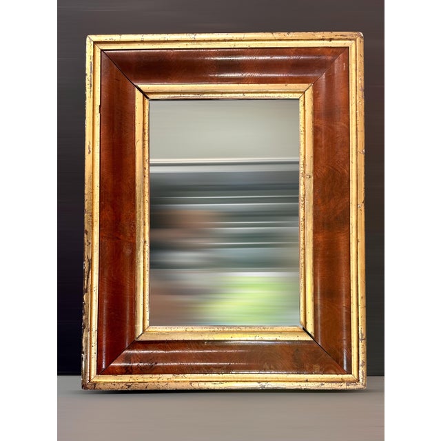 19th Century American Empire Mahogany and Gilt Ogee Wall Mirror. American Empire Period mahogany wood and gilt ogee wall...