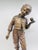 The sculpture is an antique, patinated bronze figure entitled "Elle ronfle" (She Snores) by the 19th-century French...