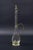 Beautiful blown glass decanter bottle. It features elegant brass appliqués representing a snake on the body and an...