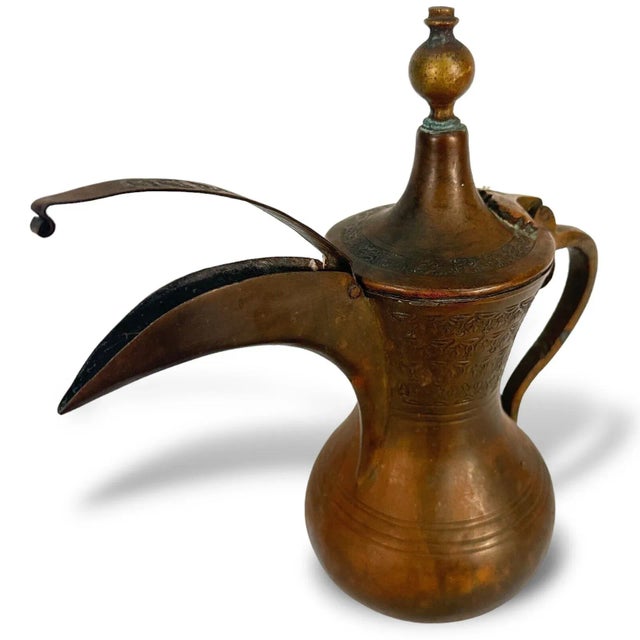 Middle Eastern Dallah Coffee Pot - 9.5" tall x 10" wide x 4" Deep. Etched and tinned copper body with brass finial and...