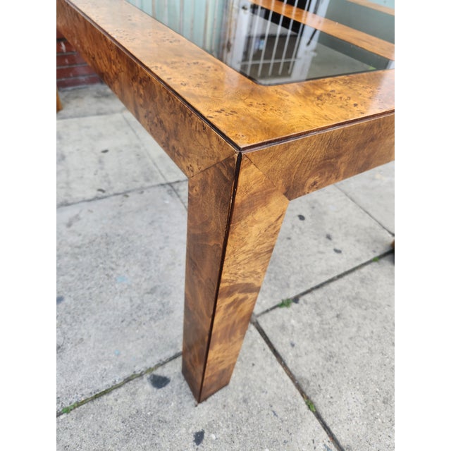 1970s burlwood and smoked glass extendable dining table, similar in style to those designed by Milo Baughman In good...