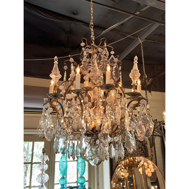 This 19th century French Louis XV bronze and crystal chandelier is a stunning piece perfect for lighting up any room. With...