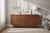This striking restored Mid-Century Modern walnut chest of drawers / long dresser showcases clean lines, refined...