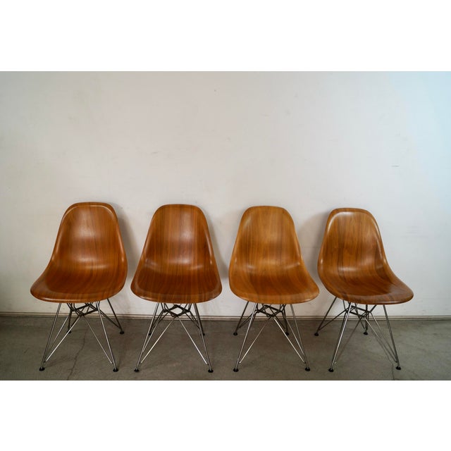 Set of four Mid century Modern Eames side chairs for sale. These are original Herman Miller side chairs, and were...