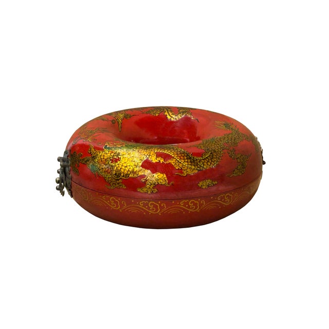 This circular vinyl cover box is designed in a unique donut or "torus" shape, featuring a hollow center and a rich,...