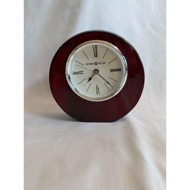 Howard Miller Adonis Mantel Clock, Reference 645-708, featuring a Rosewood Hall finish on select hardwoods and veneers....