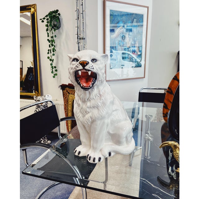 Unique handmade statue of a small tiger. This Hollywood Regency statue, made of hand-painted ceramic and made in Italy,...