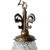 Experience the timeless allure of a mid-century Hollywood regency brass pendant, featuring a clear cut glass pineapple....