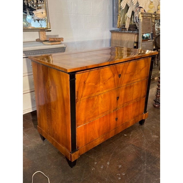 Handsome 19th century German Biedermeier walnut commode. A Biedermeier walnut commode is one of the most elegant...