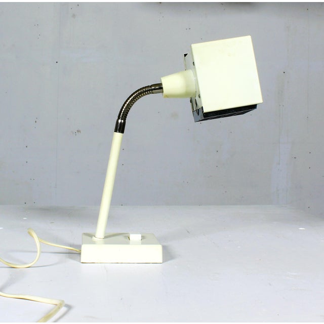 This Kuben floor lamp was designed by Björn Svensson for the Swedish Elidus manufacture. It features a flexible element at...