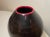 Up for sale is a wonderful hand blown studio art glass vase. It is blown into a gorgeous silhouette out of a dark black...