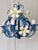 French four-light tole chandelier dating to the late 1960s-1970s. This decorative floral design features a sculptural open...