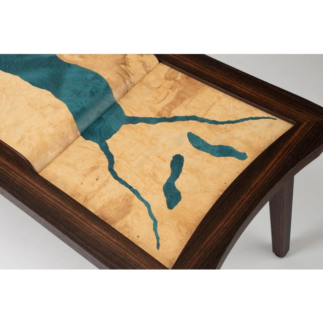David Marr's innovative creations utilize Macassar ebony, olive ash burl, and vibrant dyed ash in blue, resulting in...