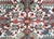 A gorgeous early 20th century Persian Heriz rug with a mirrored floral pattern with myriad stylized flowers and leaves,...