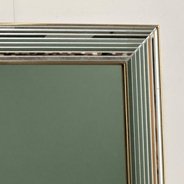 Striking 1980s DeKnudt “Disco” mirror featuring its iconic stepped mirrored frame with thin horizontal bevelled stripes...