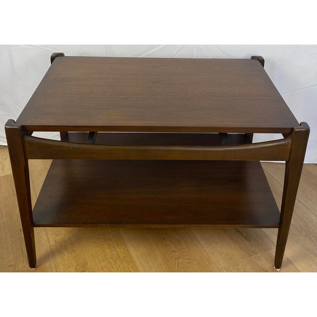 Very fine quality pair of Mid Century Modern Sculptural solid walnut end tables by the Bassett Furniture Co. Sculpted...