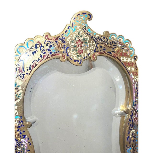 An exquisite late-19th-century French dressing-table mirror, finely crafted in gilt bronze and brass with elaborate...