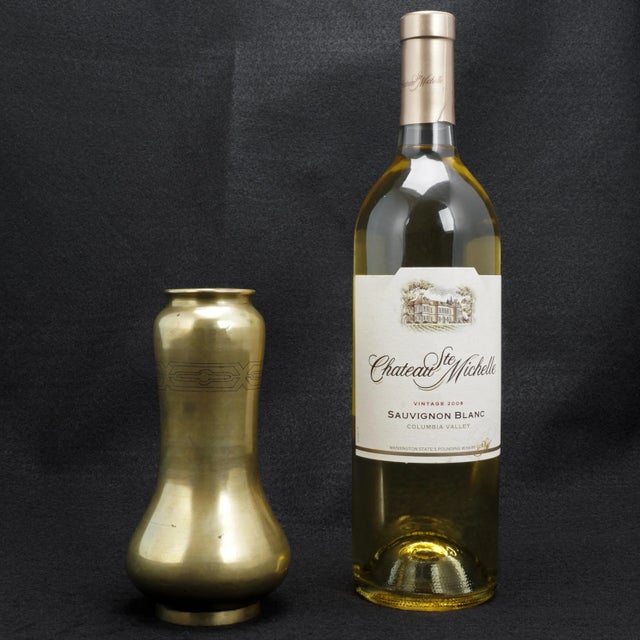 A heavy and well-executed Japanese vase in the Art Nouveau style. The heavy bronze has been shaped in a design that is...