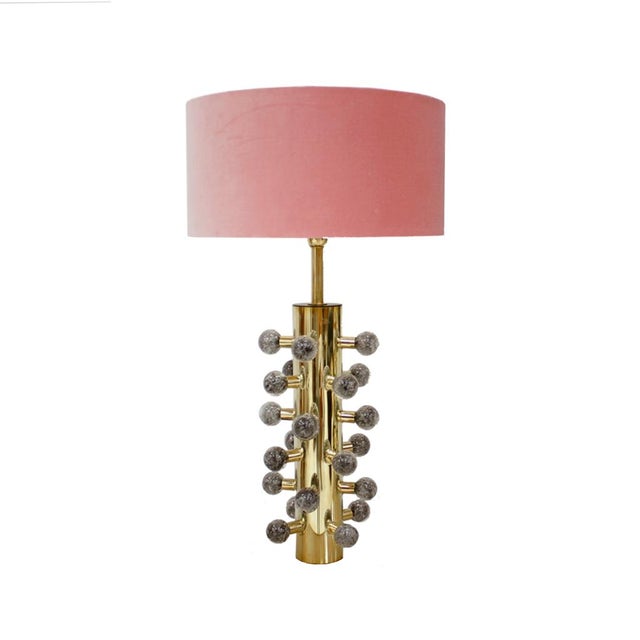 Pair of sculptural Italian table lamps with cylindrical structure made of polished brass and grey Murano glass spheres....