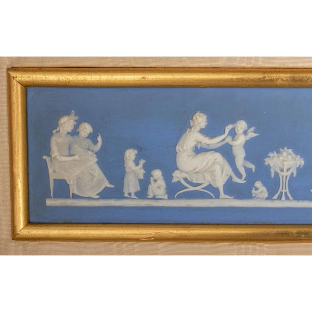 Wedgwood blue dip jasperware bas relief panel, likely late 19th century, and depicting classical women and children at...
