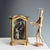 Carved and gilded wooden case containing a polychrome wax sculpture depicting the "Education of the Virgin Mary." The...