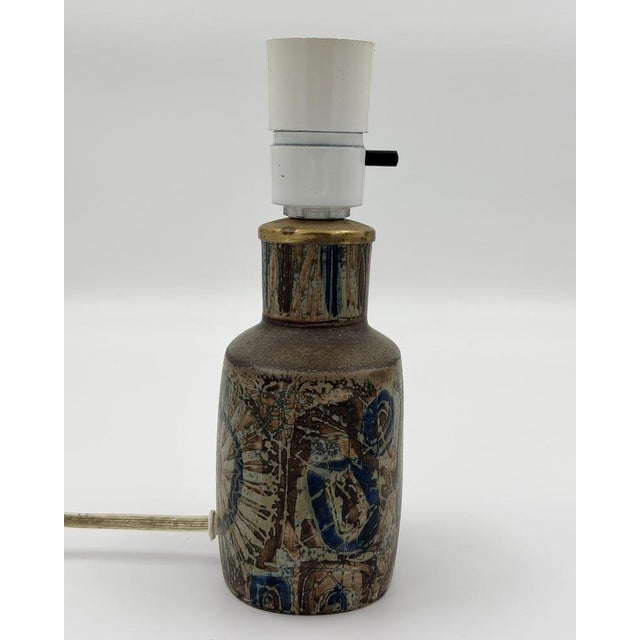 This authentic Danish table lamp features a sophisticated relief decor from the "Baca" series, designed by the renowned...