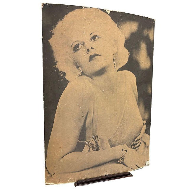 This glamorous 1950s matte poster-size photograph captures Hollywood icon Jean Harlow in an alluring yet tasteful pose....