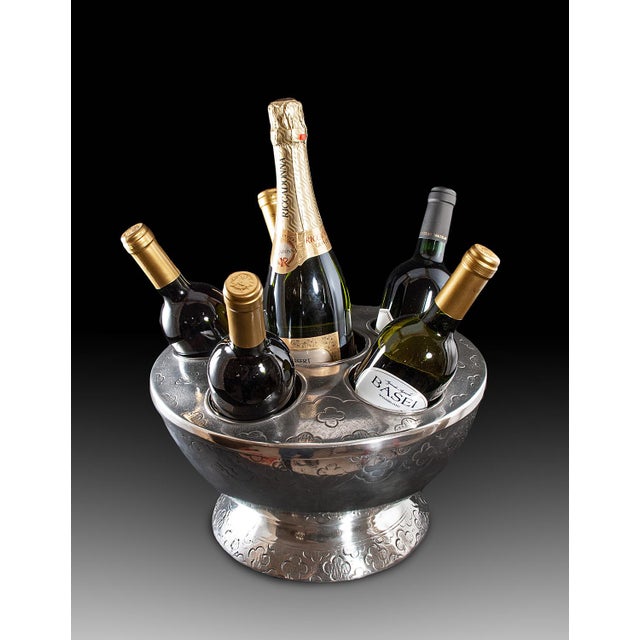 Handcrafted in Italy, this pewter wine cooler holds up to six bottles of wine or champagne in individual compartments to...