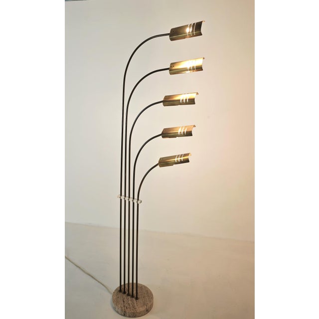 This iconic five-light arched floor lamp is attributed to the renowned Italian designer Goffredo Reggiani and was produced...