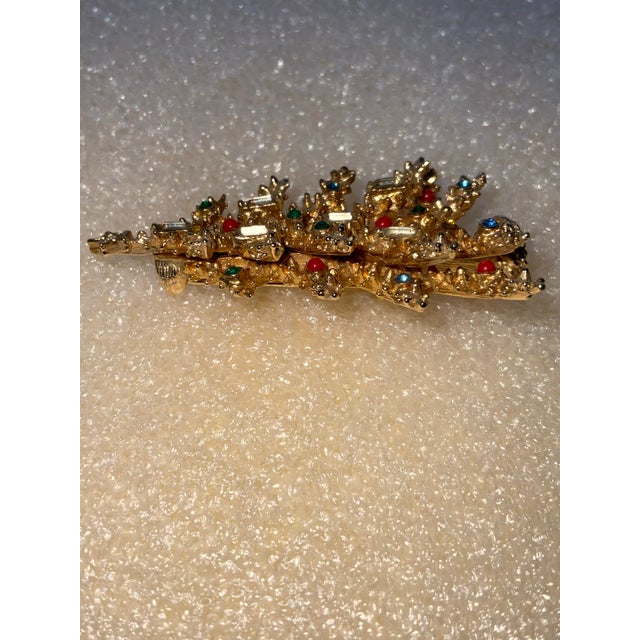 Christmas Tree Signed Art. Multicolored rhinestones and 6 clear rhinestone candles Measuring 2.25” high by 1.r” wide