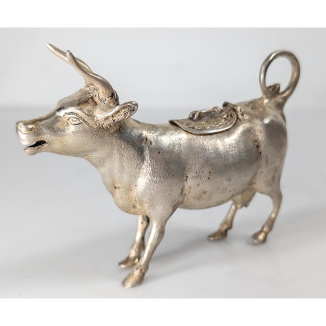 We are selling this nice little silver German cow form creamer. This silver cow is marked 800 silver with German...