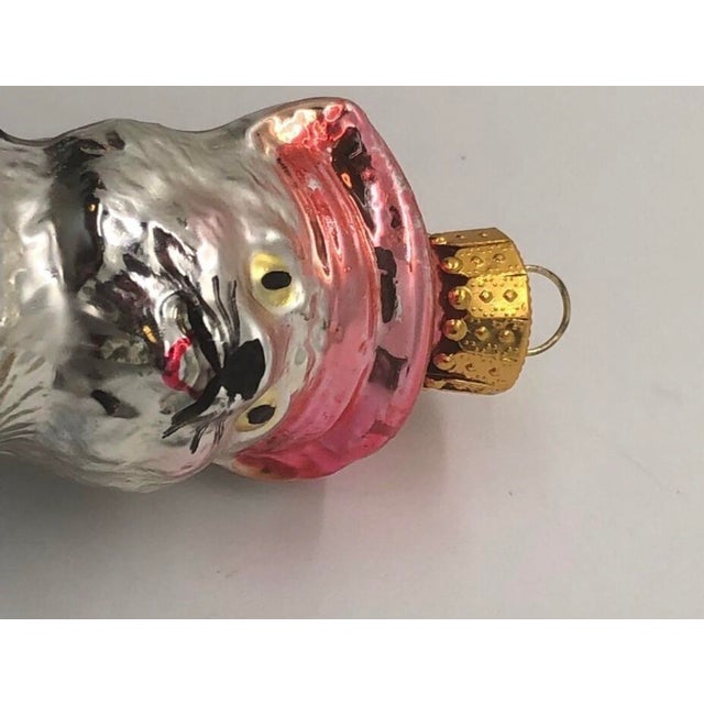 Add whimsical charm to your holiday tree with this delightful figural ornament!This beautiful hand-blown glass Christmas...